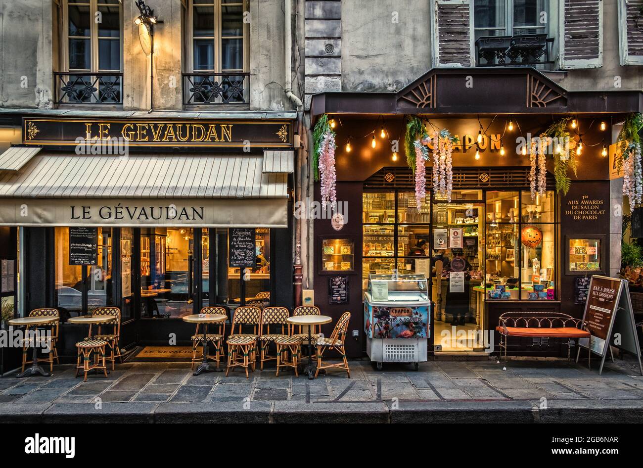 Paris, France, Feb 2020, view of the facades of “Le Gevaudan” a bar-Brasserie and “Chapon” a chocolate store` in the 7th district of the capital Stock Photo